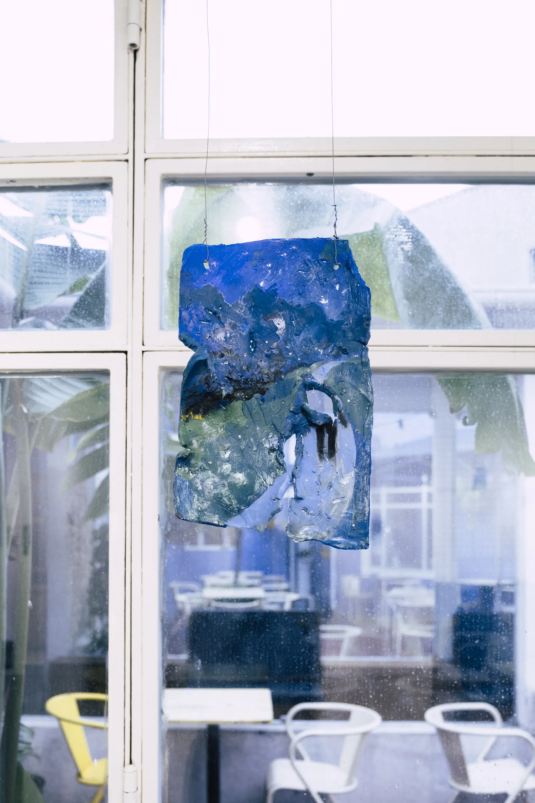 Espelho Meu: painted piece hung in front of a glazed window. Photo: Jenniffer Lima Pais